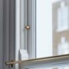 Belmont para blokad do okna typu Sash – Antyczny mosiądz
